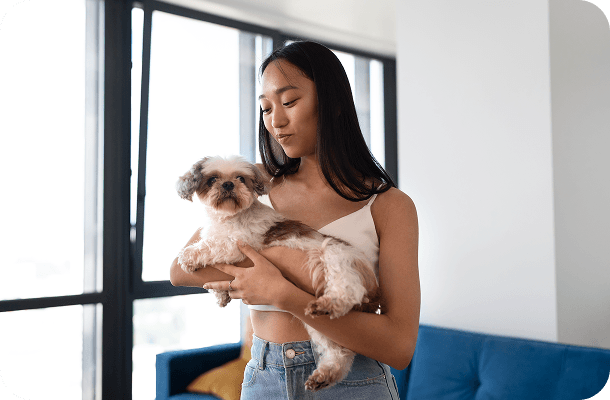 Vet carrying a pet in a carrier